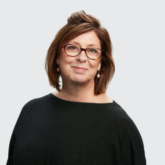 Person smiling with glasses