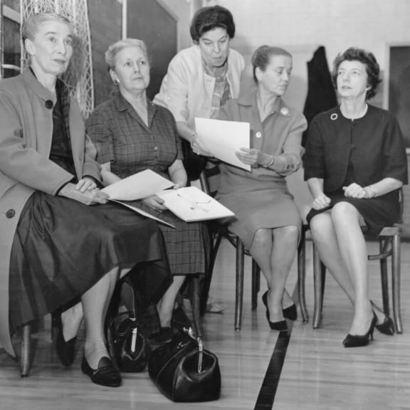Five women sitting down