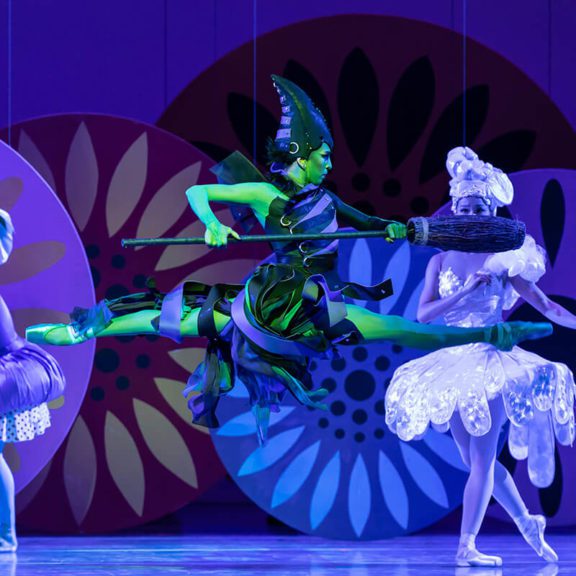 Ballet Dancer Dressed as Wicked Witch Jumping on Stage