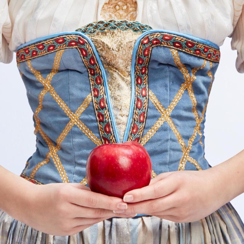 Woman holding apple Snow White