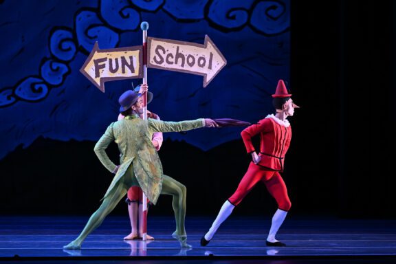 A photo from the CB2 production of Pinocchio featuring Pinocchio and Cricket.